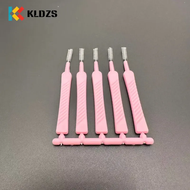 Sikat Interdental sing bentuke sirah pancuran